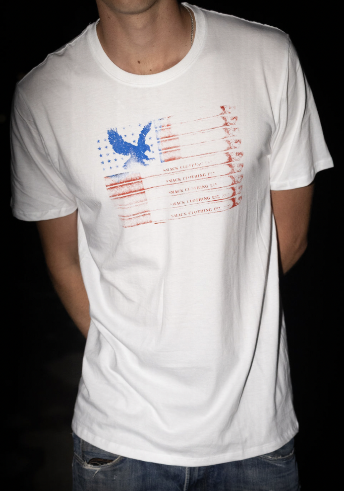 White Smack Clothing tee with faded red and blue flag print